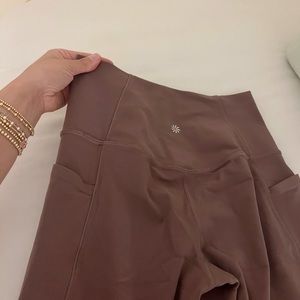 athleta brand flare leggings with pockets.